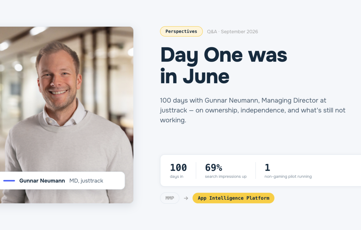 Blog header image for 'Day One Was in June,' a Q&A with Gunnar Neumann, Managing Director at justtrack, marking 100 days in the role, with stats on search growth and a non-gaming pilot, and a reframe from 'MMP' to 'App Intelligence Platform.'
